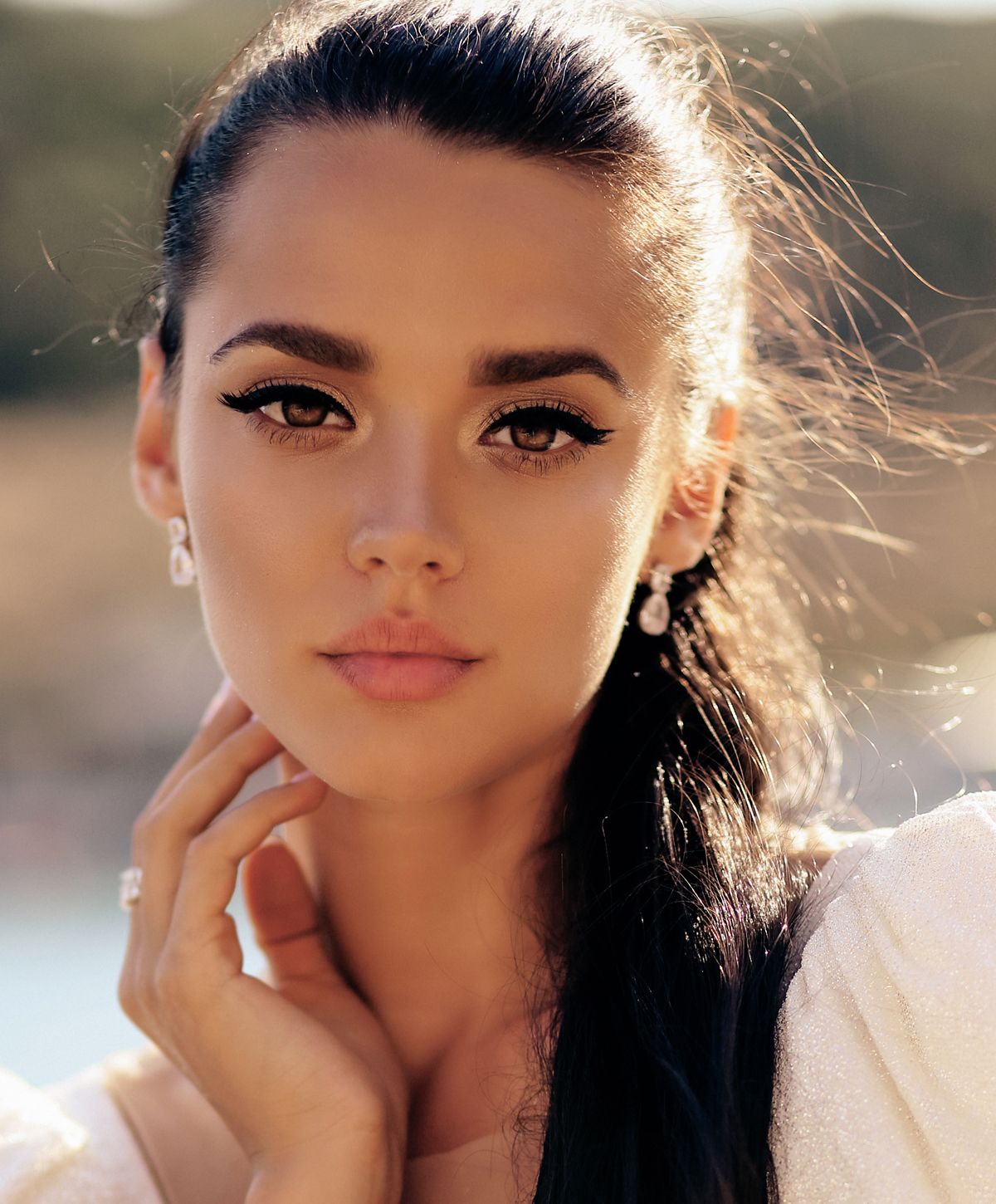 Close-up portrait of a woman with elegant makeup.