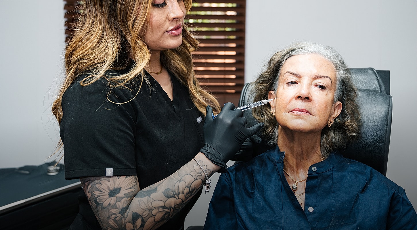 Woman receiving cosmetic treatment in a clinic.