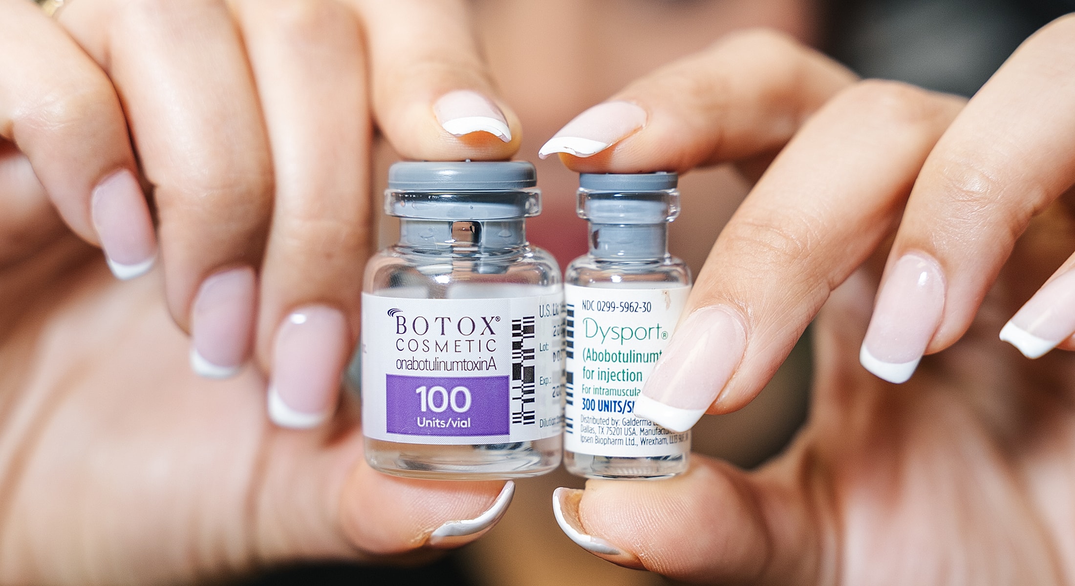 Vials of Botox and Dysport treatments held.