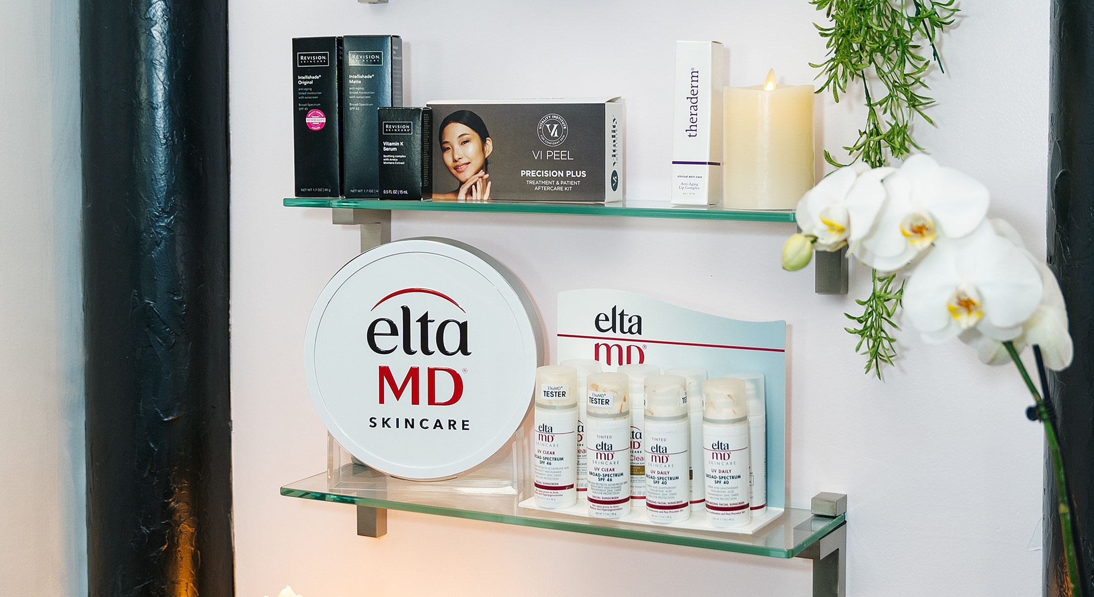 Skincare products displayed on glass shelves.