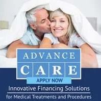 Couple under blanket promoting medical financing solutions.