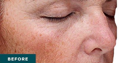 Woman with natural facial features and light makeup.